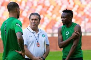 Super Eagles coach  with team’s  during Mozambique match
