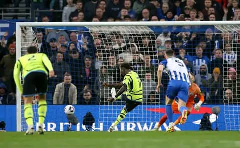Arsenal reclaim top spot following classic victory over Brighton.
