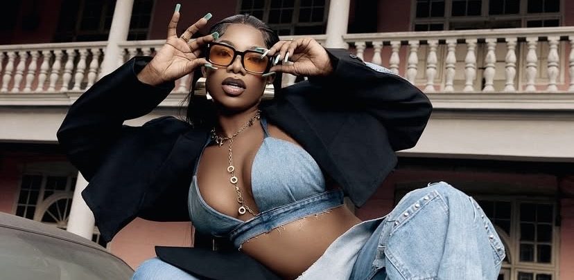 Tacha finally Removes Davido's Tattoo A