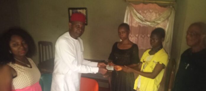 Anambra Correspondents' chapel Chairman, Mr Ilozue (on white senator), presenting the token to late Nweze's widow The late Nweze